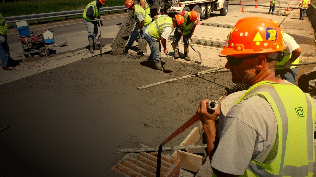 Artisan Concrete crew pouring and finishing a fresh concrete slab in Perth